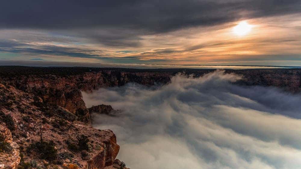 Watch the Grand Canyon overflowing with clouds in the wake of