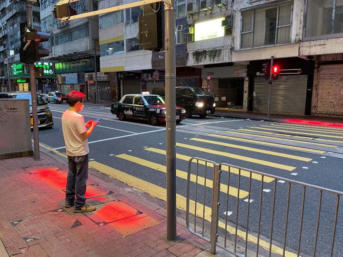 Hong Kong is trialing groundlevel signal lights so pedestrians can see