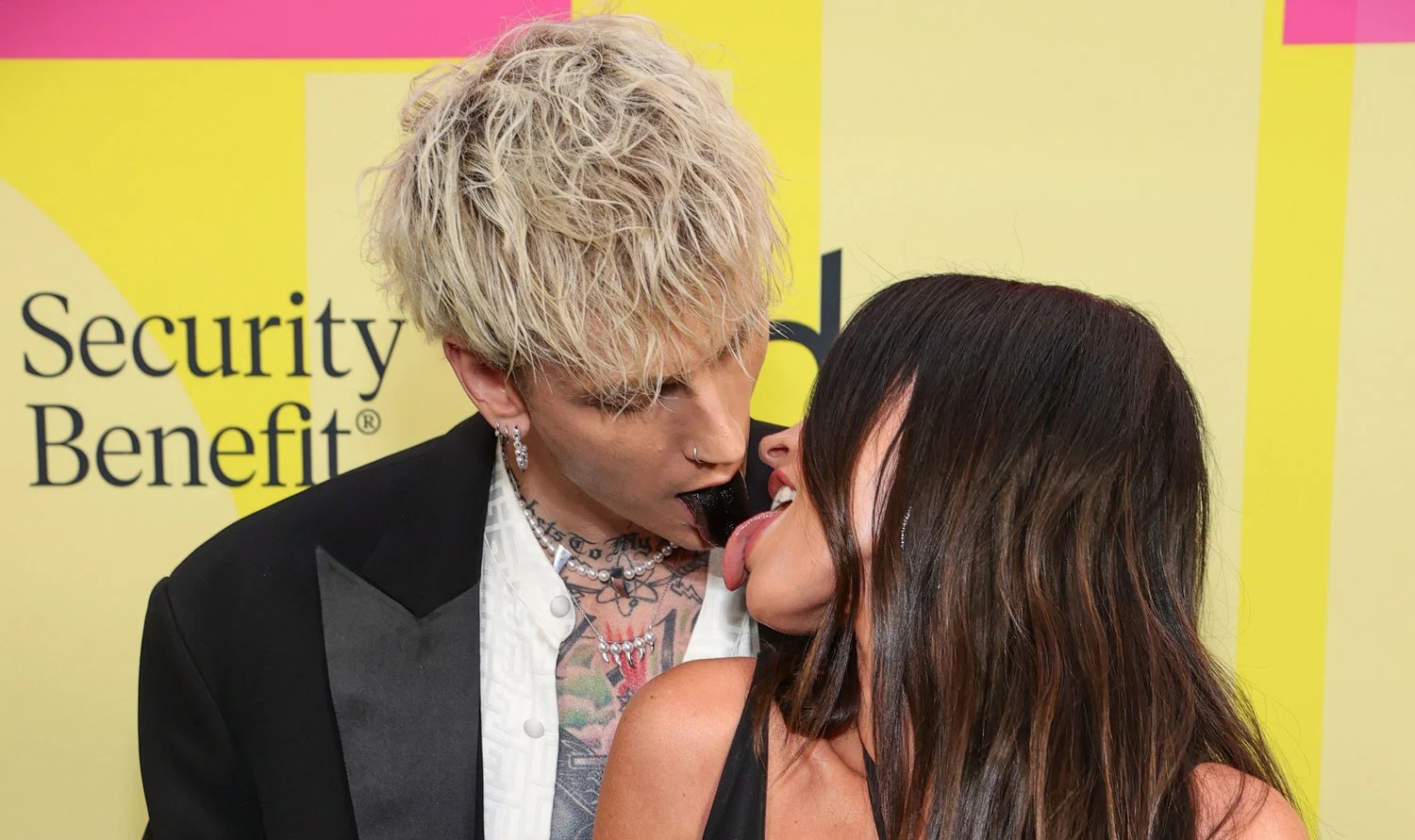 Megan Fox Licks Machine Gun Kelly’s Black Tongue at Billboard Music