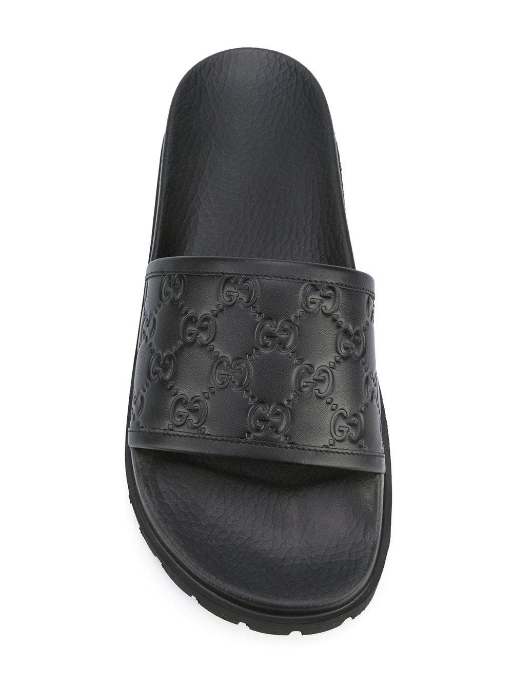 Gucci Leather Logo Embossed Slides in Black Lyst