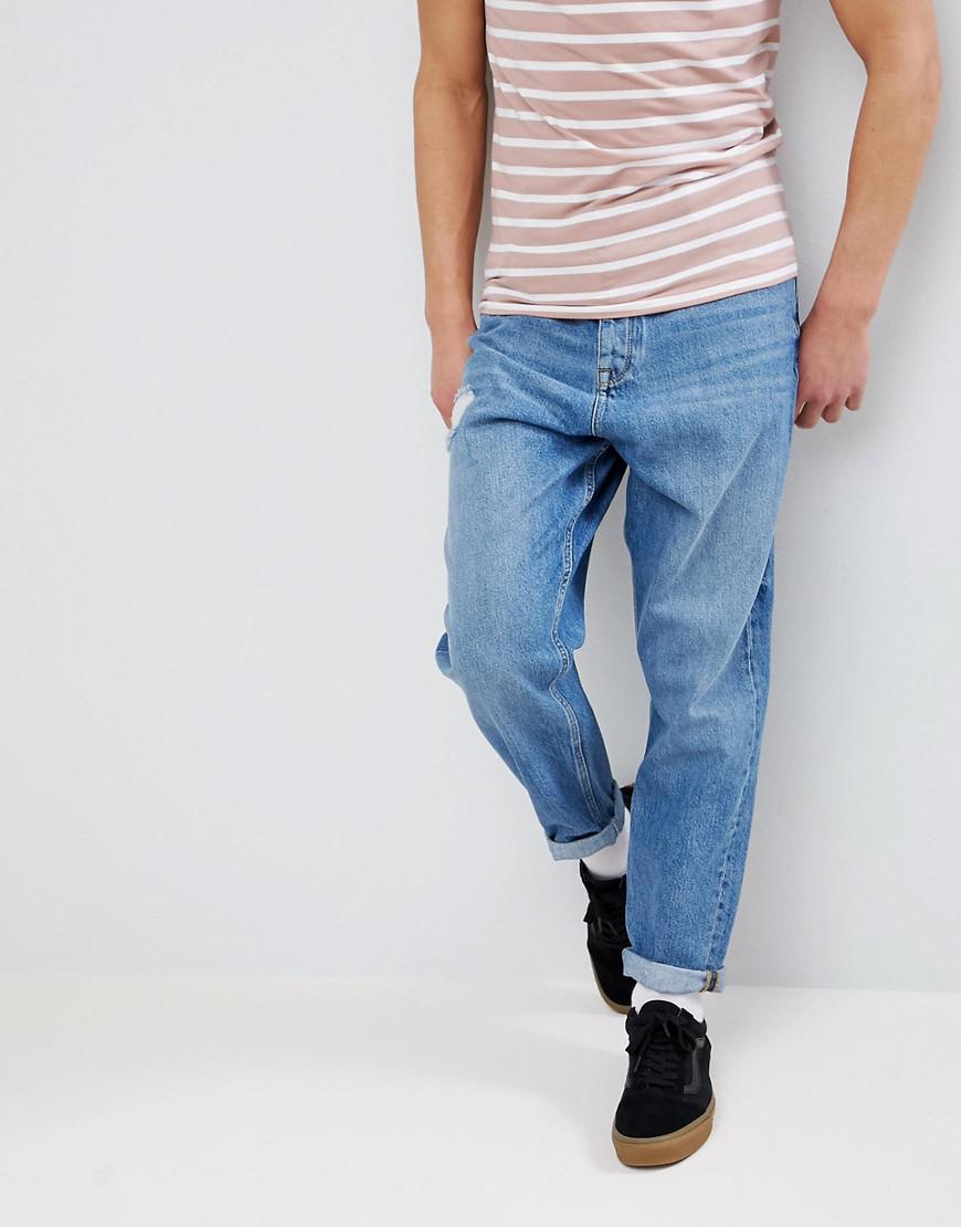 Lyst Asos Balloon Tapered Jeans In Mid Wash With Rip in Blue for Men