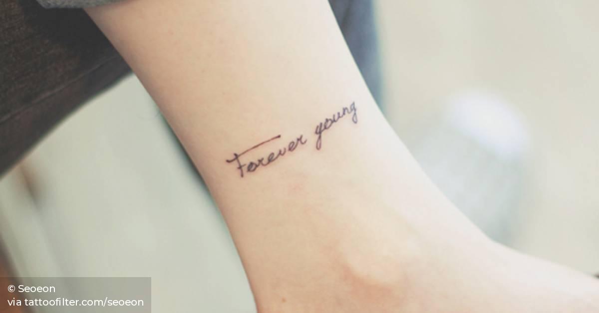 Ankle Tattoo Saying "Forever Young" By Seoeon. 628_x_1200_jpg
