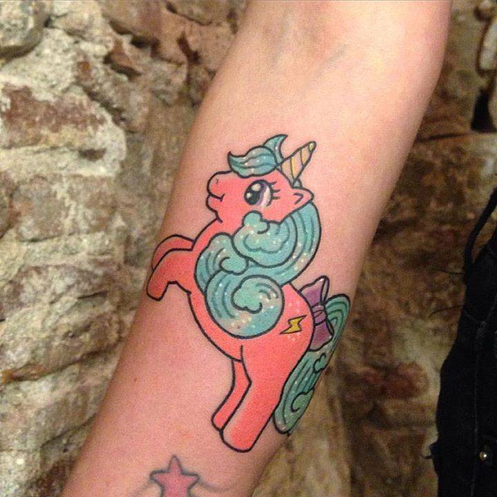 Little kawaii style unicorn tattoo on the right inner
