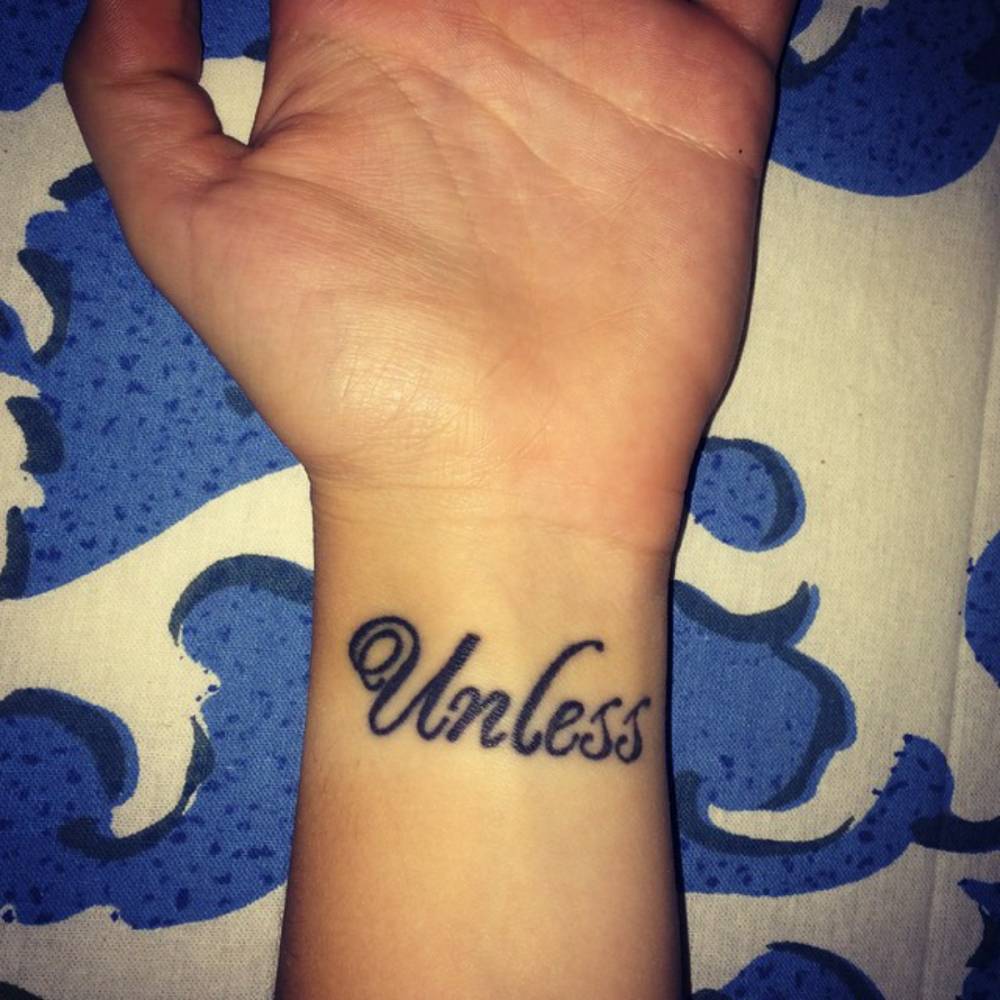 Wrist tattoo saying "Unless" on Kimberly Lynn Nolan.