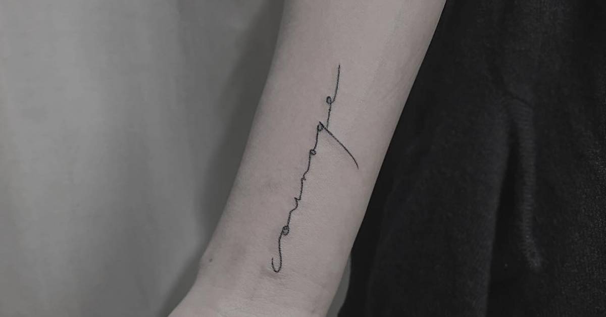 "Courage" tattoo on the right inner wrist.