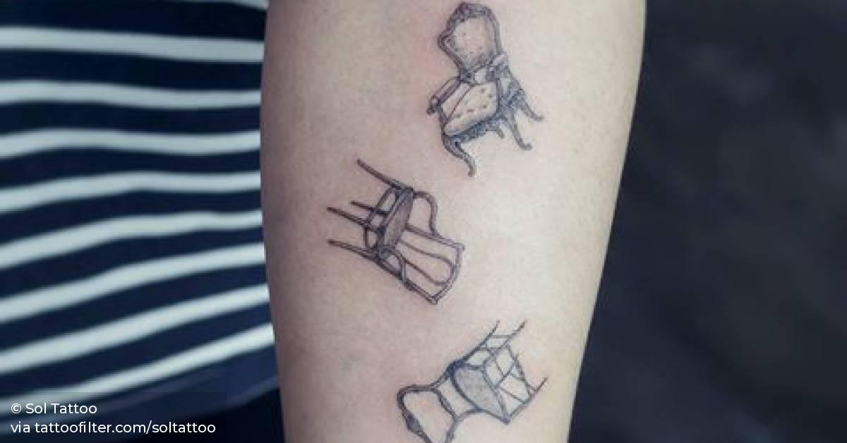 Three falling chair tattoos on the left inner forearm.