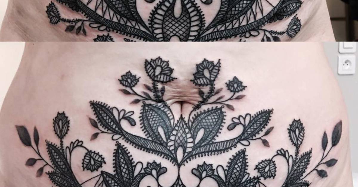 Lace style stomach tattoo.
