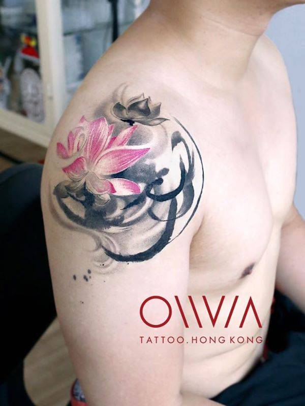 Graphic lotus flower tattoo on the right shoulder.