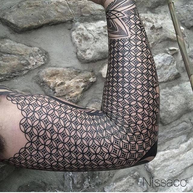 Patterned sleeve tattoo.