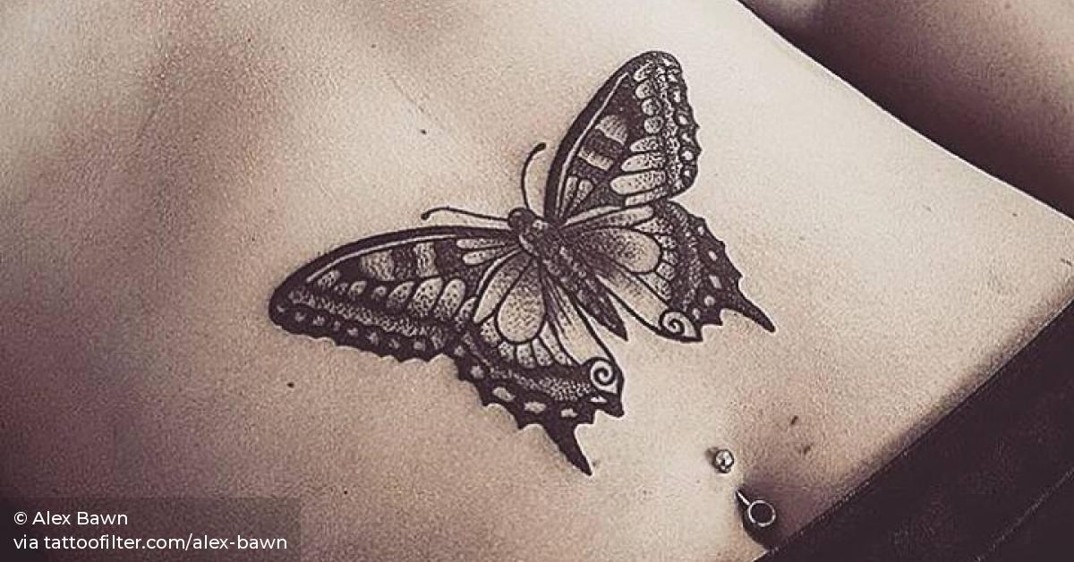 Butterfly tattoo on the stomach and unalome on the