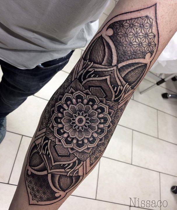 Sacred geometry arm tattoo.