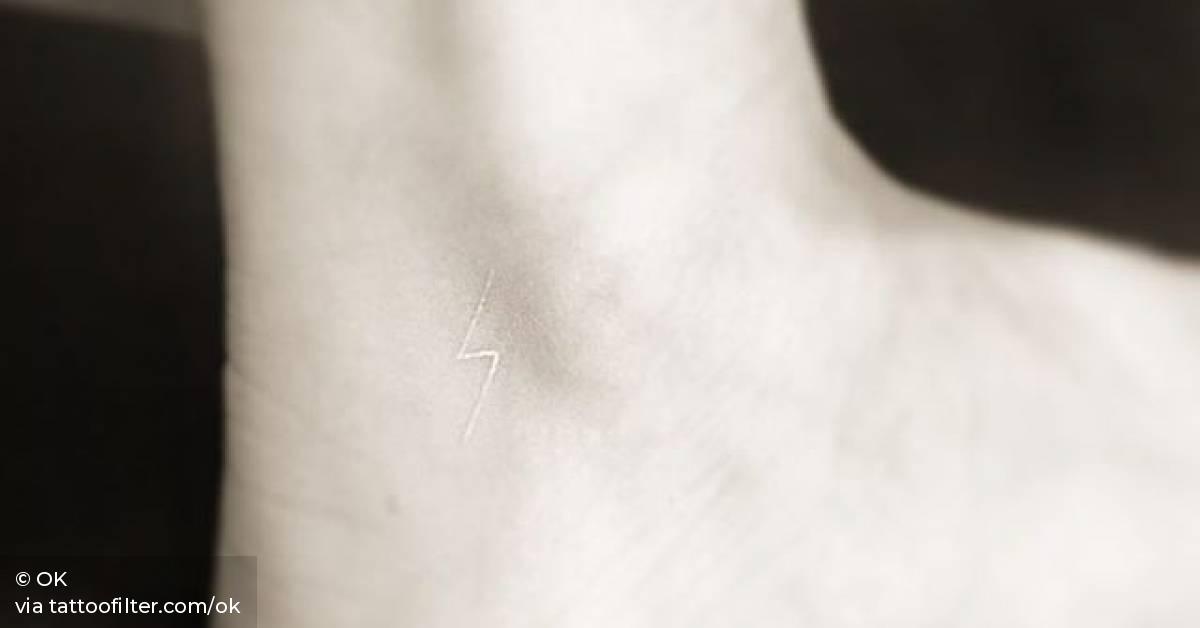 White Ink Lightning Bolt Tattoo On The Ankle. 628_x_1200_jpg