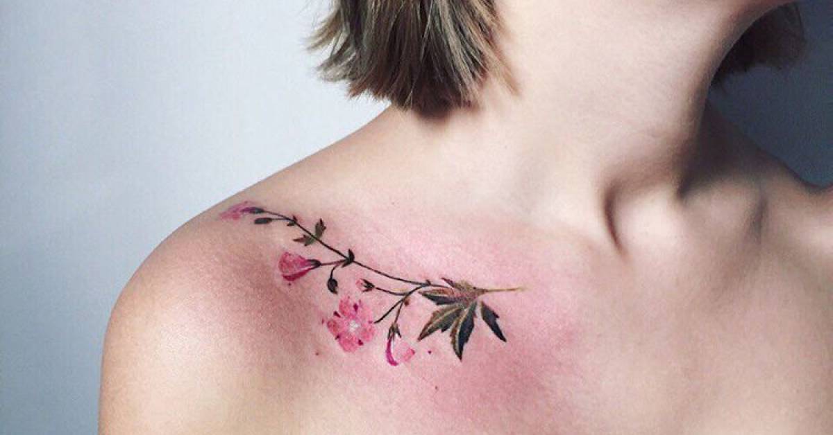 Geranium tattoo on the right collarbone.