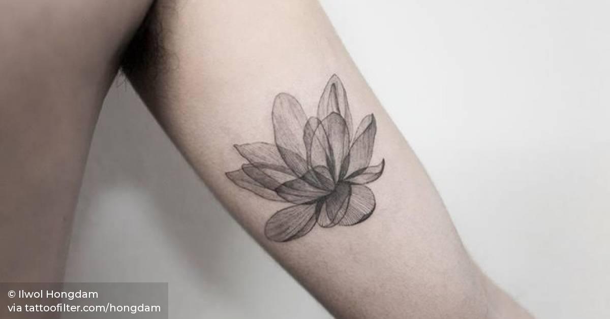 Xray lotus tattoo on the left inner arm.