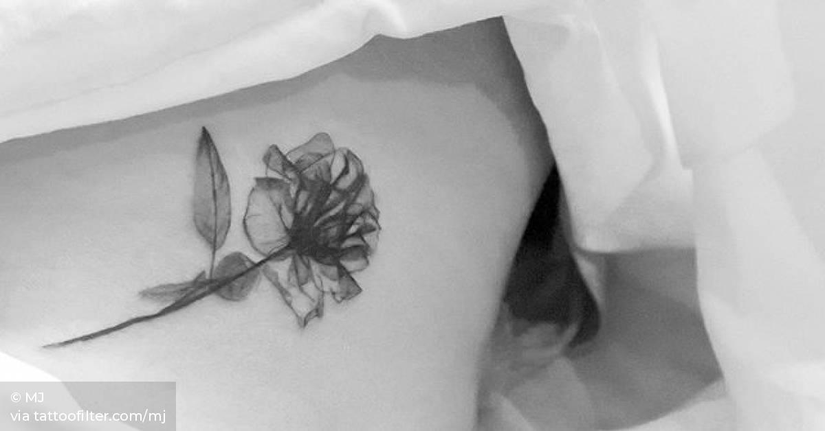 XRay rose tattoo on the left side ribcage.