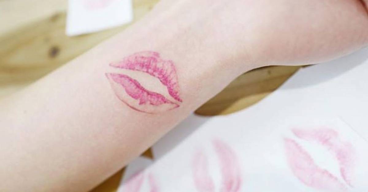 Kiss mark tattoo on the inner wrist.