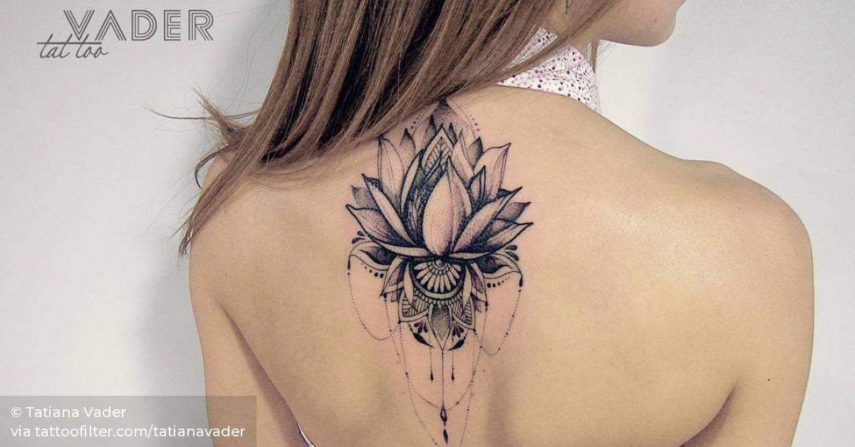 Lotus flower tattoo on the upper back (done in 23