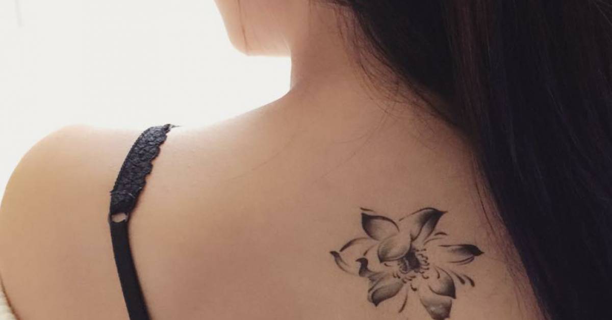 Upper Back Tattoo Of A Lotus Flower On Jessie Cui. 628_x_1200_jpg