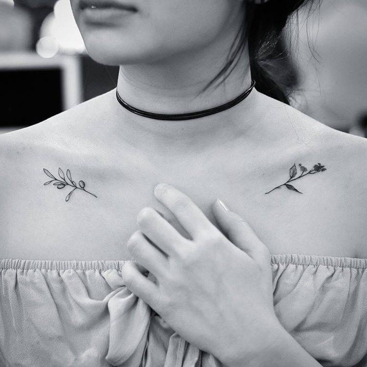 Olive branch and mustard plant tattoos.