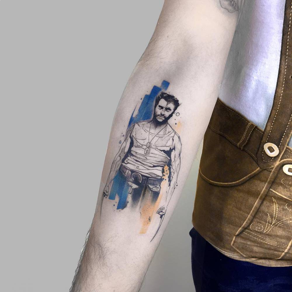 Wolverine tattoo on the inner forearm.