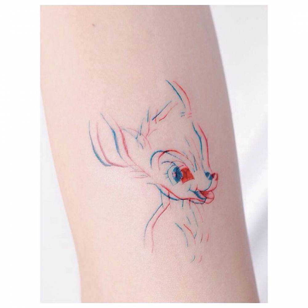 Optical illusion style Bambi tattoo on the forearm.