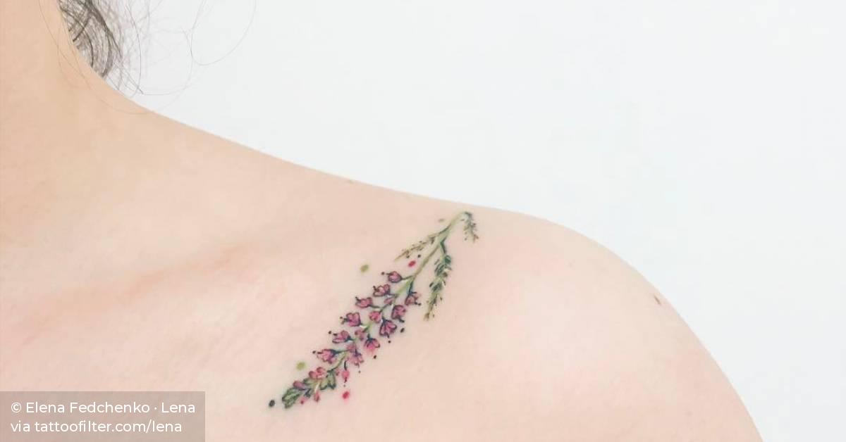 Healed lavender tattoo on the left shoulder.