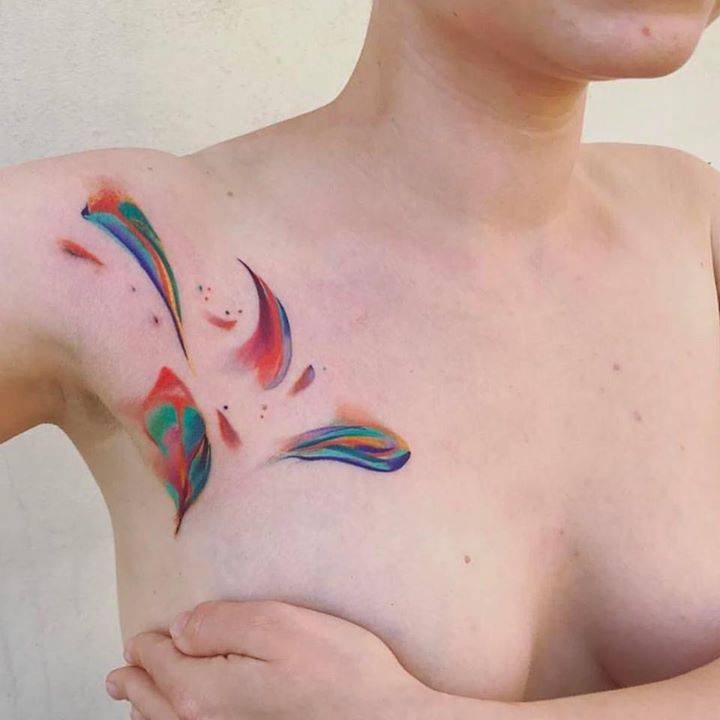 Watercolor tattoo on the right chest and shoulder.