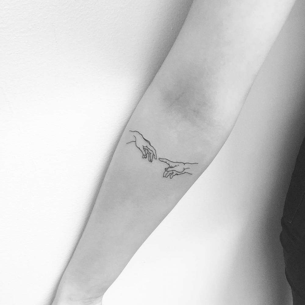 The creation of Adam inspired tattoo on the right inner