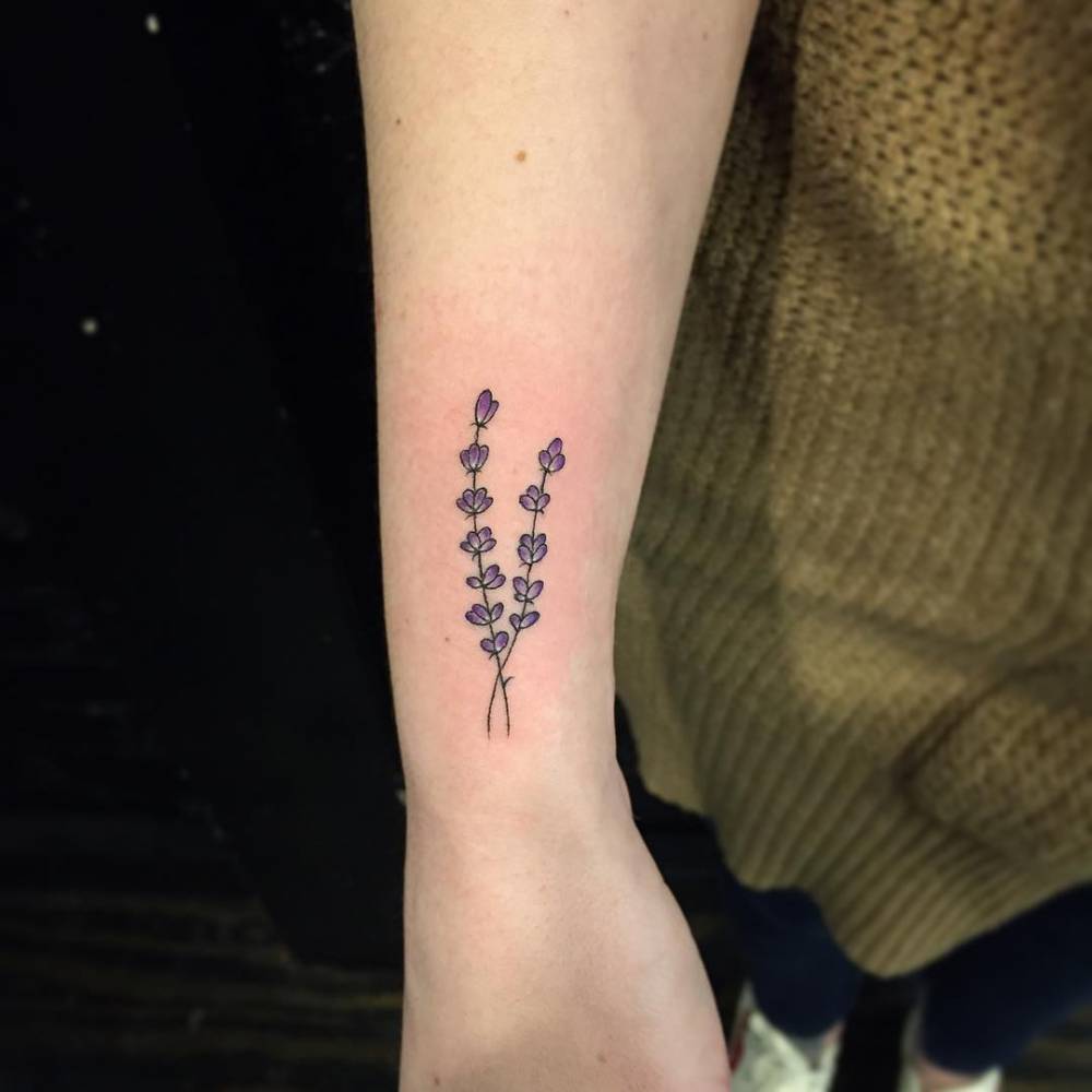 Lavender sprig tattoo on the right wrist.