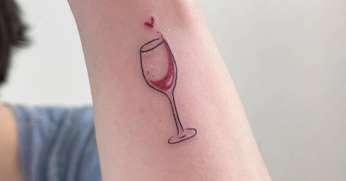 Fine line wine glass tattoo