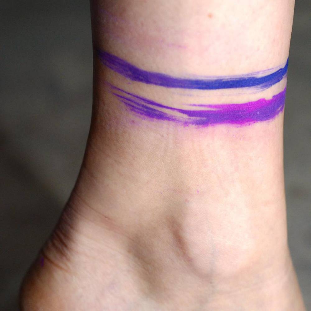 Watercolor anklet tattoo.