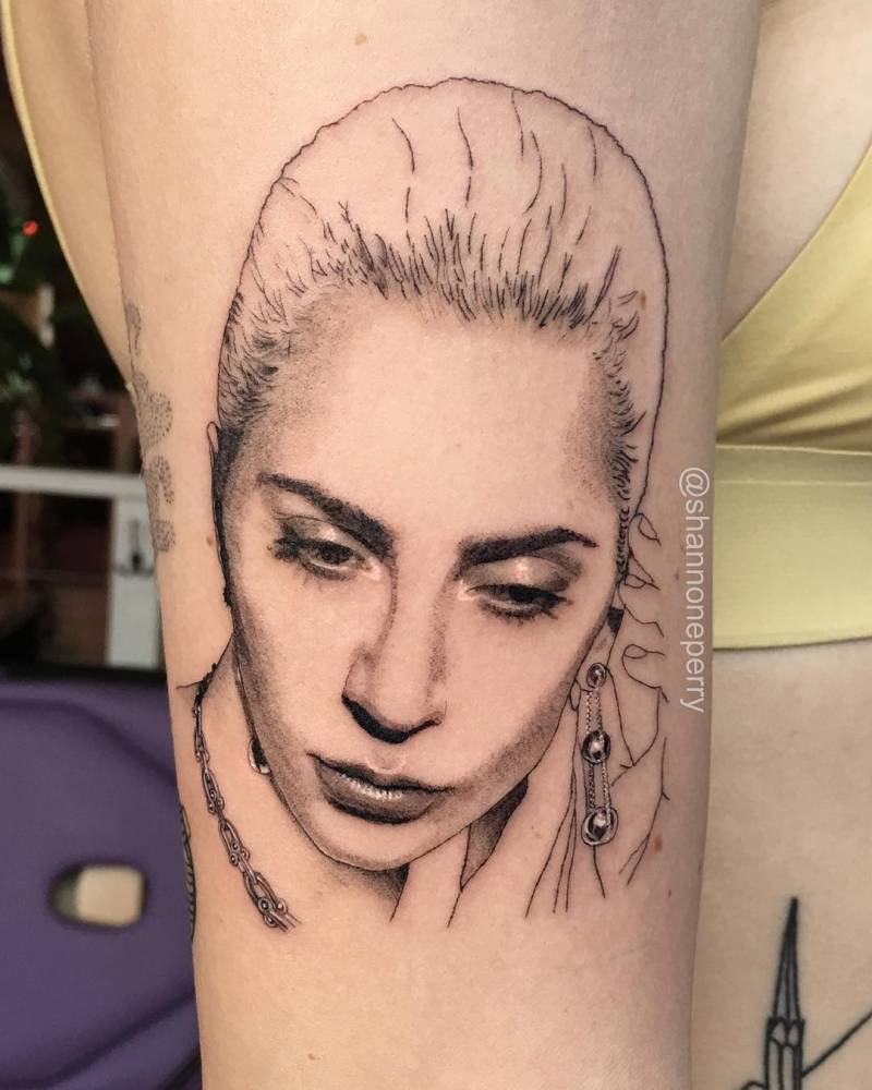 Lady Gaga's single needle portrait tattoo on the right
