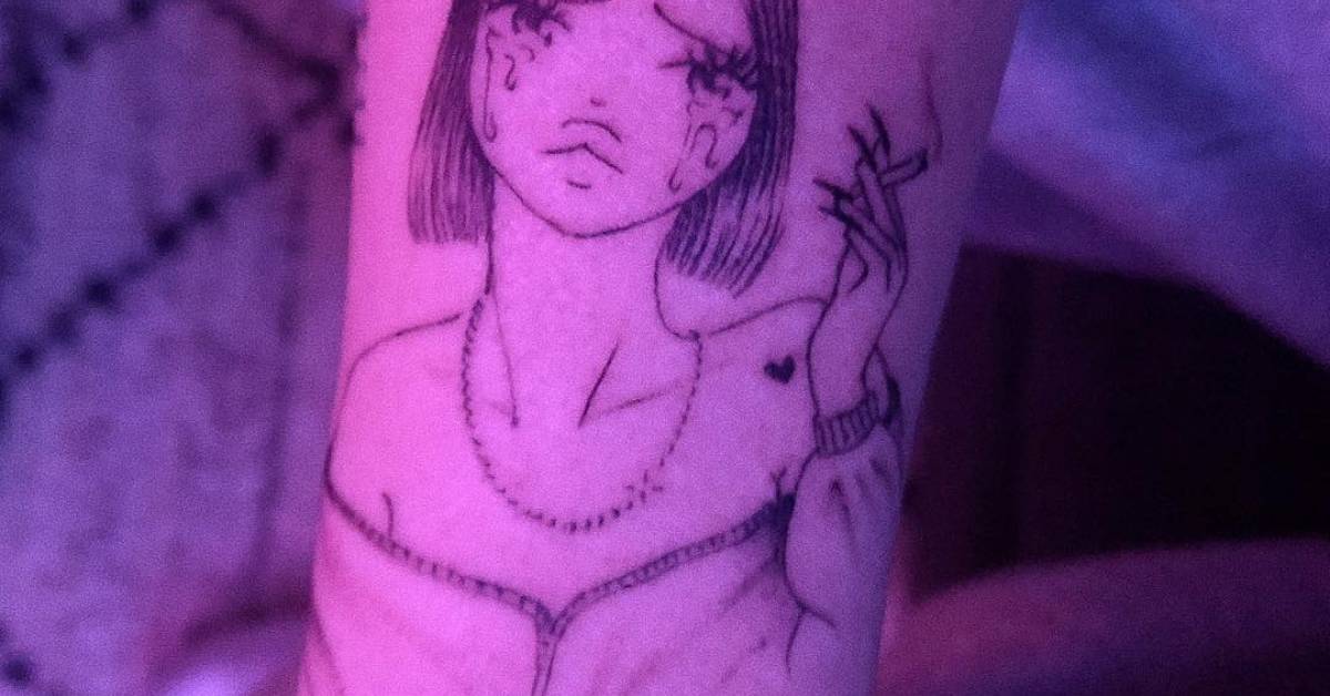 Noah Cyrus' self cartoon portrait tattoo on her forearm