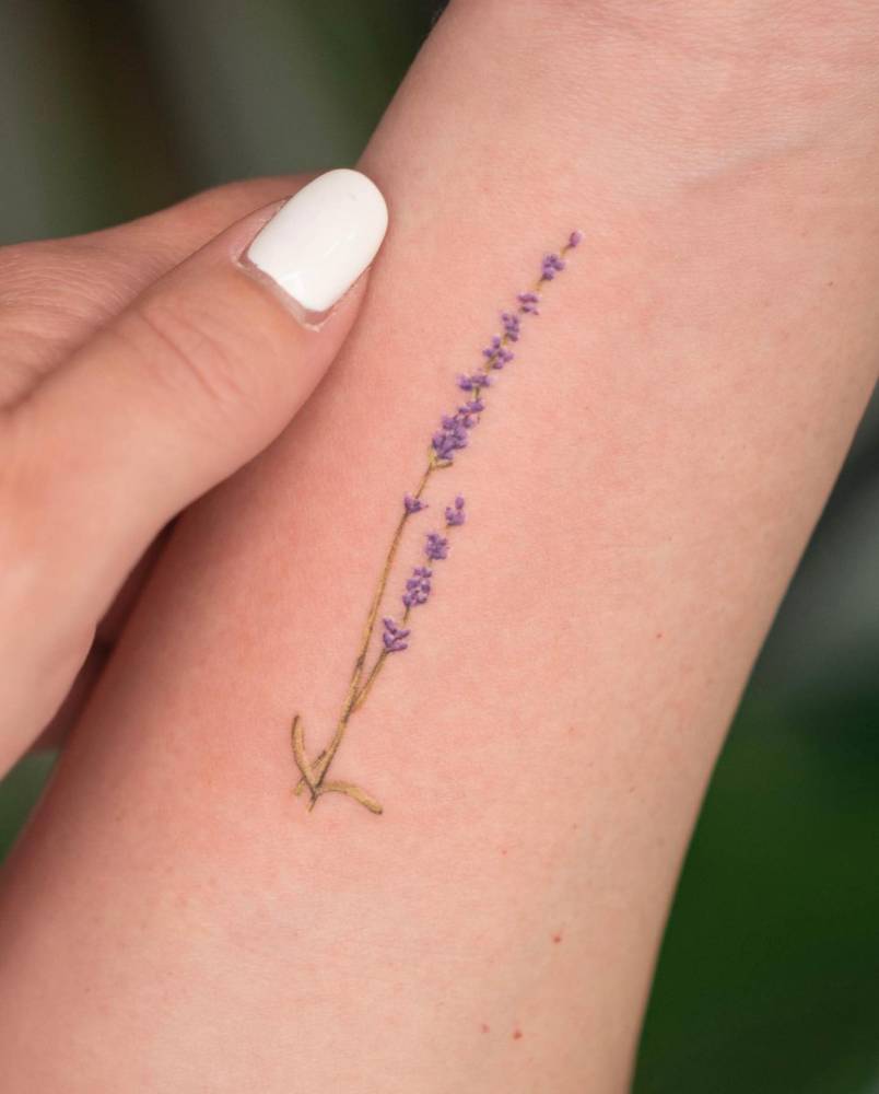 Microrealistic lavender tattoo on the inner forearm