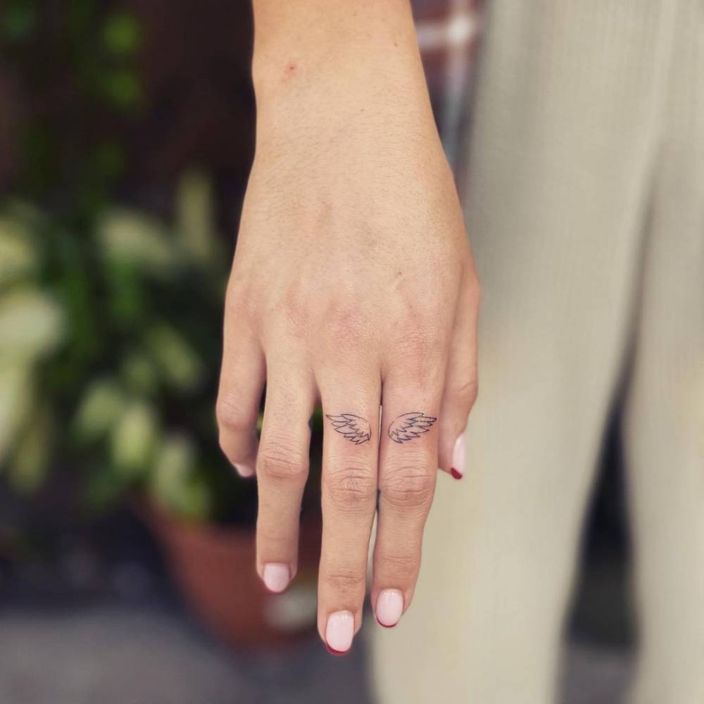Fine Line Wings Tattooed On The Finger 1000_x_1000_jpg