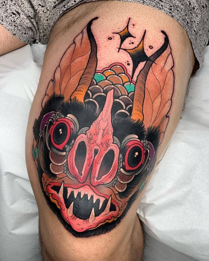 Neotraditional bat tattoo on the knee/thigh