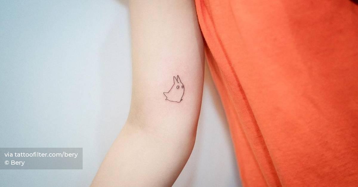 Minimalist Totoro tattoo on the inner arm