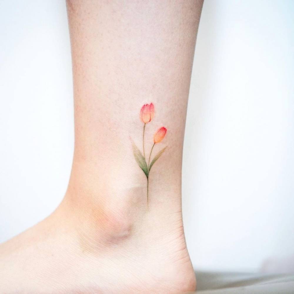 Watercolor tulip tattoo on the ankle