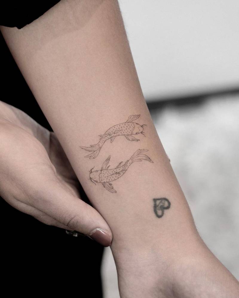 Single Needle Koi Fish Tattoo On The Inner Forearm. 1000_x_800_jpg
