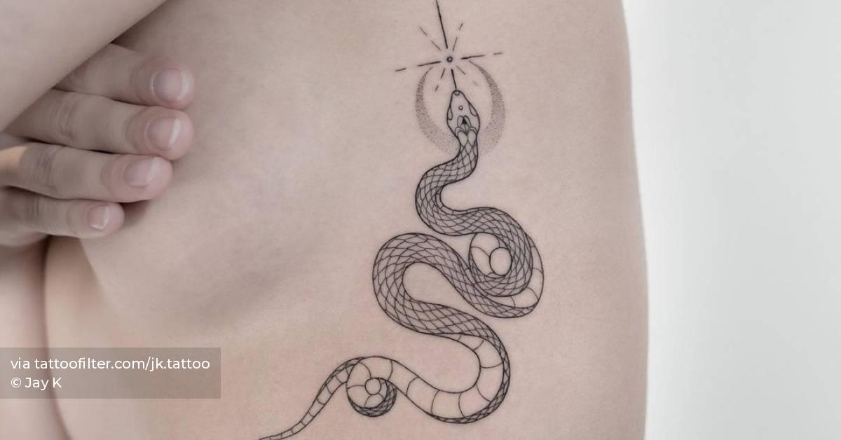 Fine line snake tattoo on the rib.