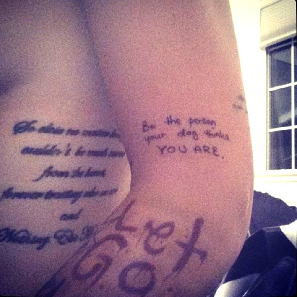 Ruby Rose's upper arm tattoo "be the person your dog