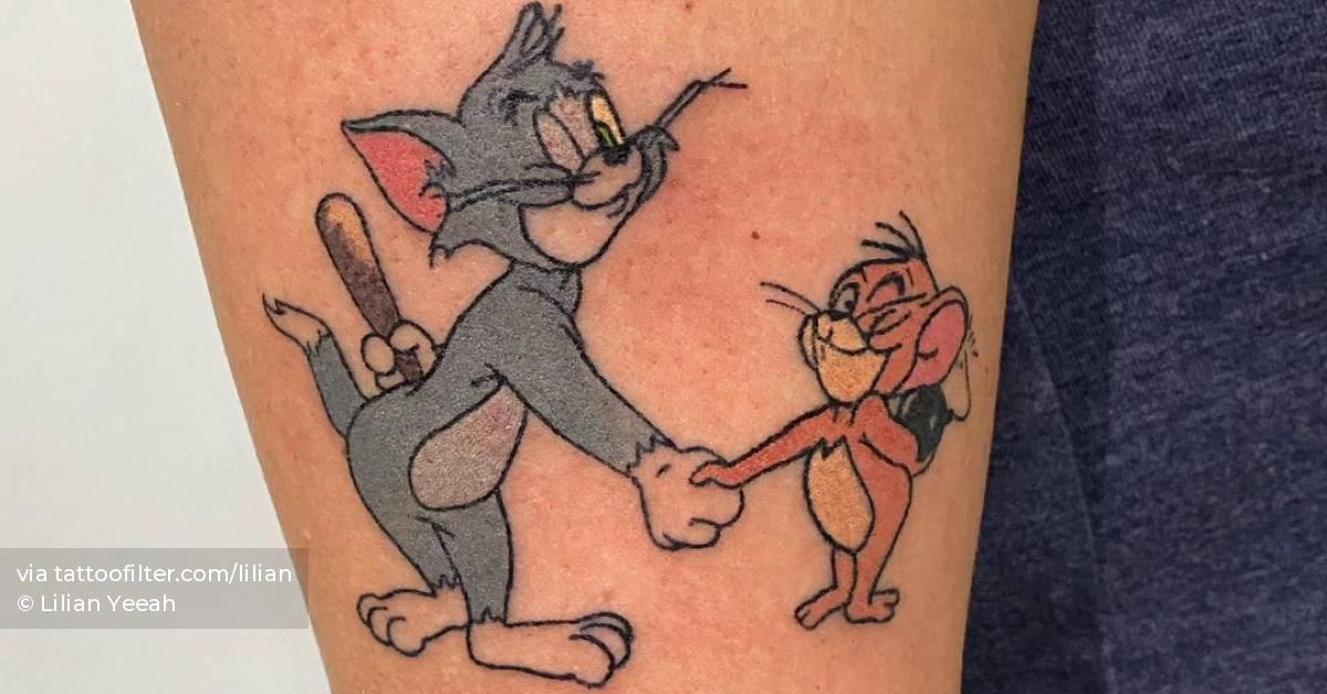 Hand Poked Tom And Jerry Tattoo On The Upper Arm. 628_x_1200_jpg