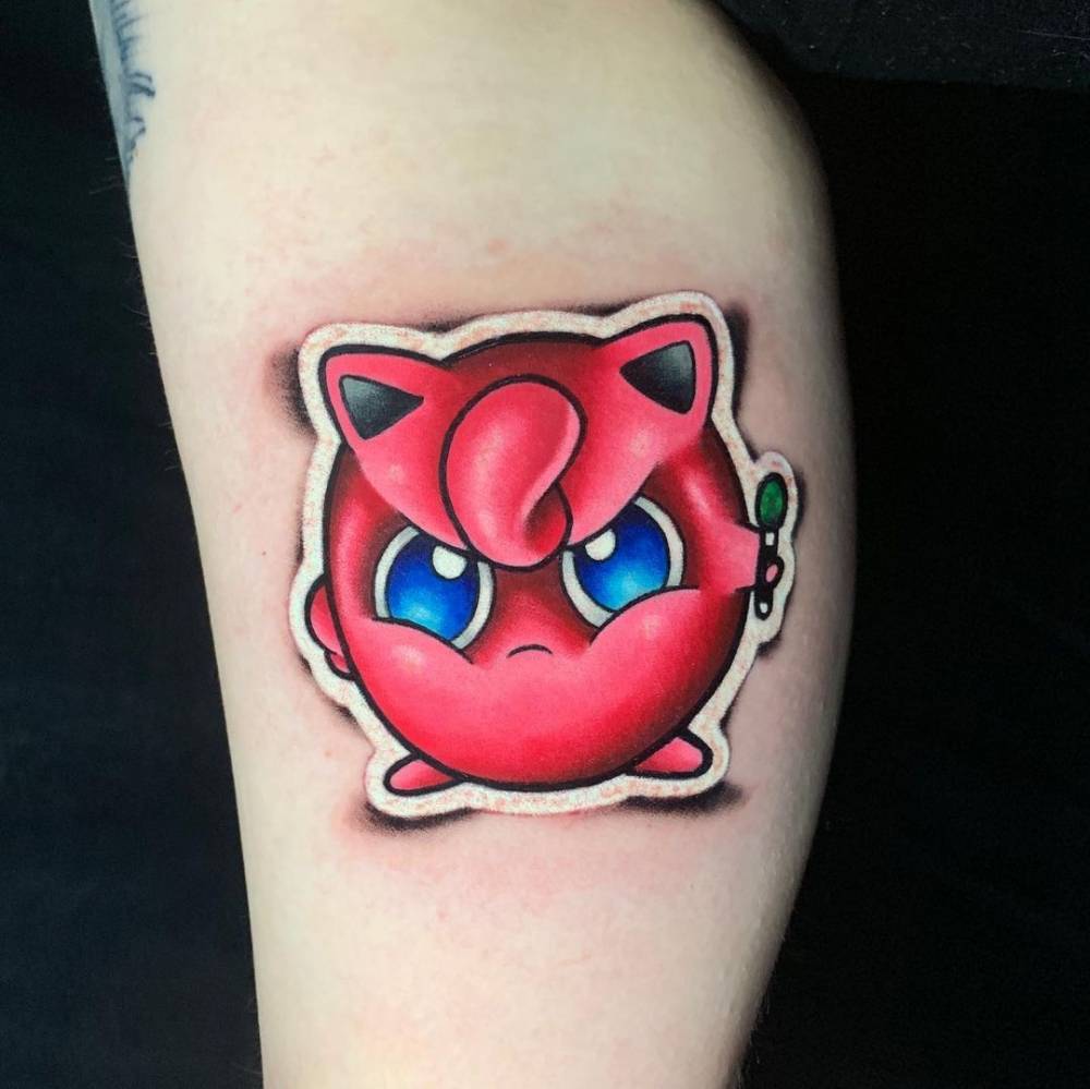 Jigglypuff sticker tattoo on the inner arm.
