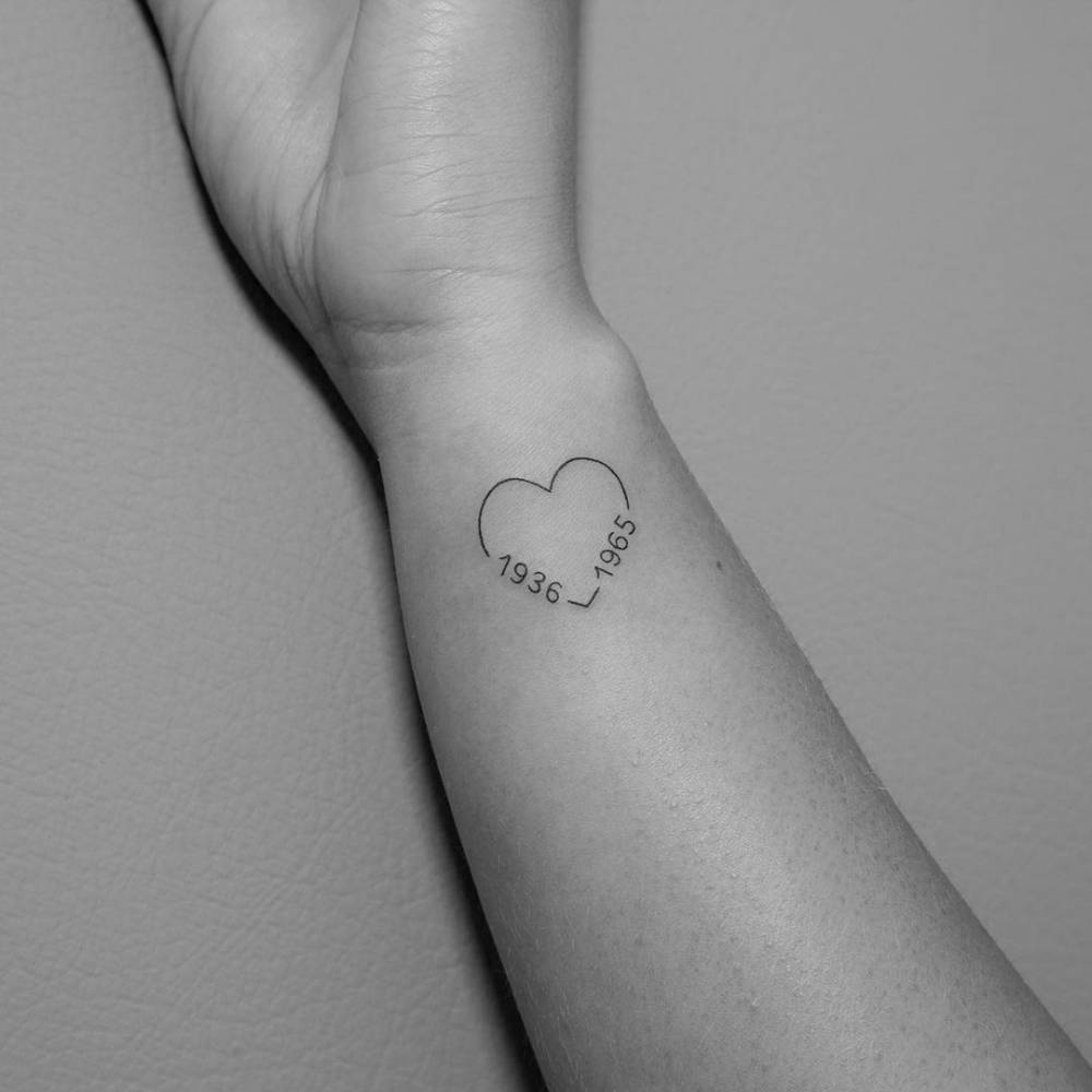 Fine Line Heart And Birth Years Tattoo On The Wrist. 1000_x_1000_jpg