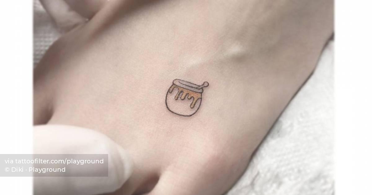 Minimalist honey pot tattoo on the foot.