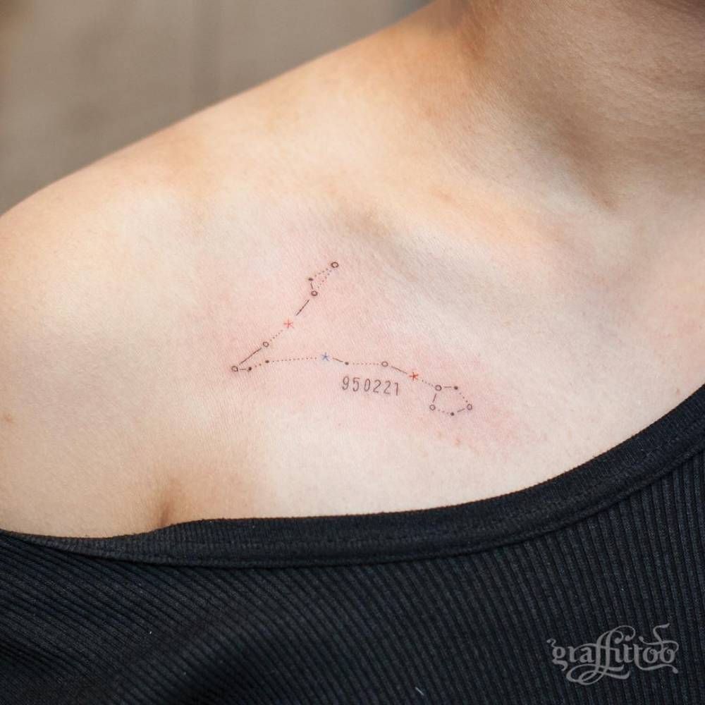 Pisces constellation tattoo on the right collarbone.