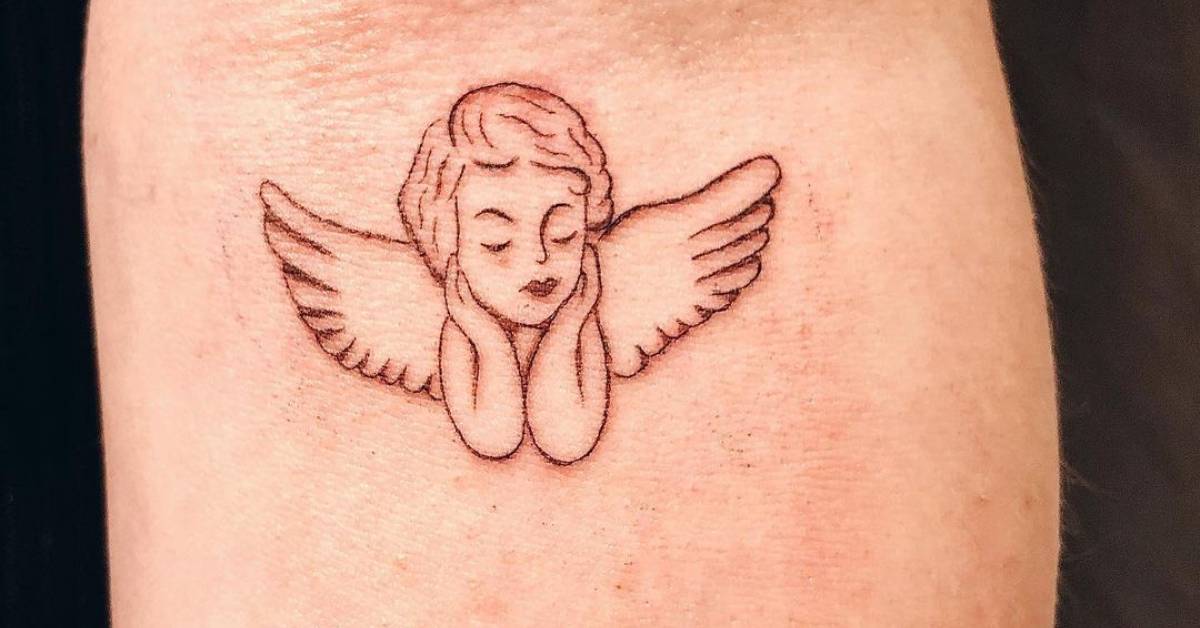 Small cherub tattoo done in fine line, located on the