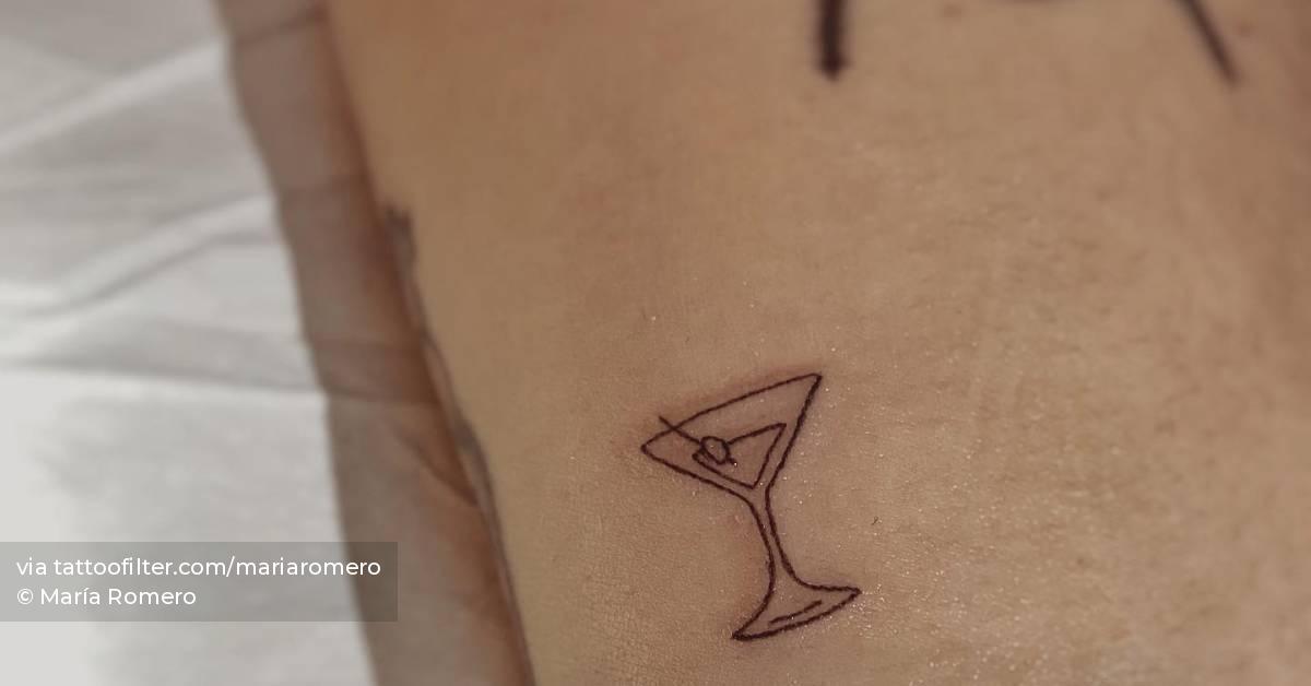 Tiny martini cocktail tattoo located on the inner