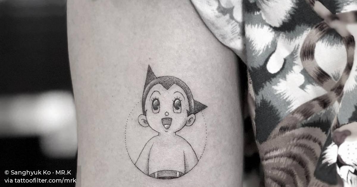 Single needle Astro Boy tattoo on the bicep.