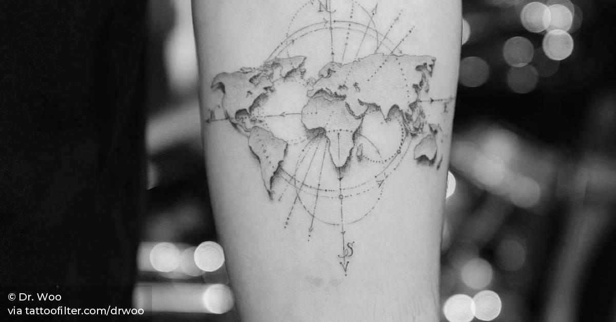 Single needle world map tattoo on the left inner